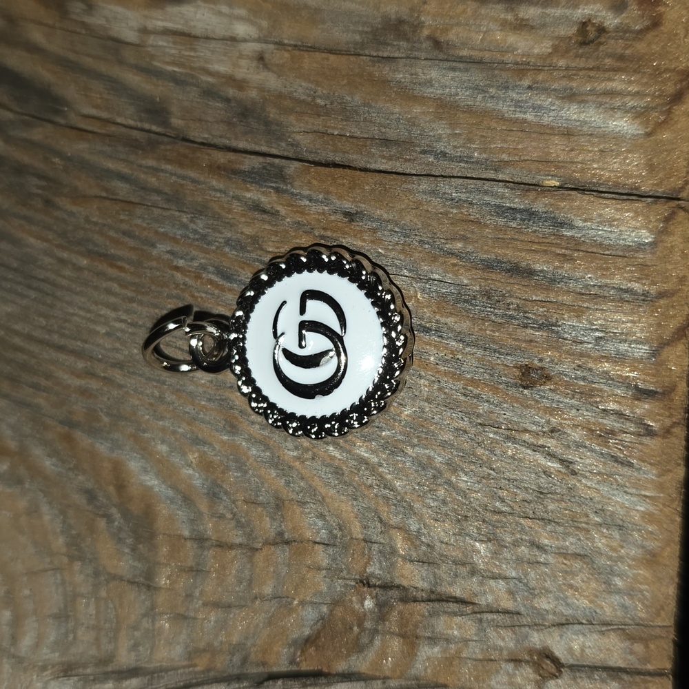 Excellent preowned condition, vintage Gucci charm, white & silver.